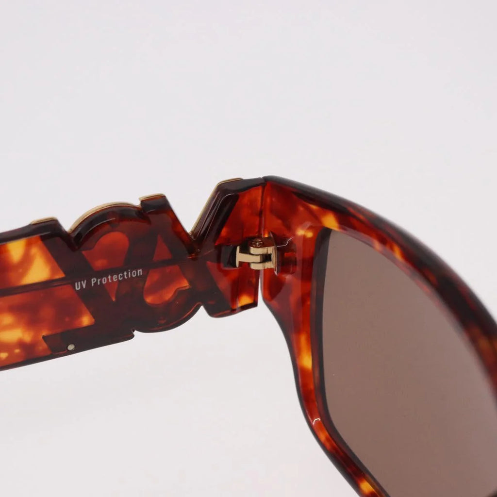 Yves Saint Laurent Vintage Tortoise Sunglasses — Sculptural Logo Hinge