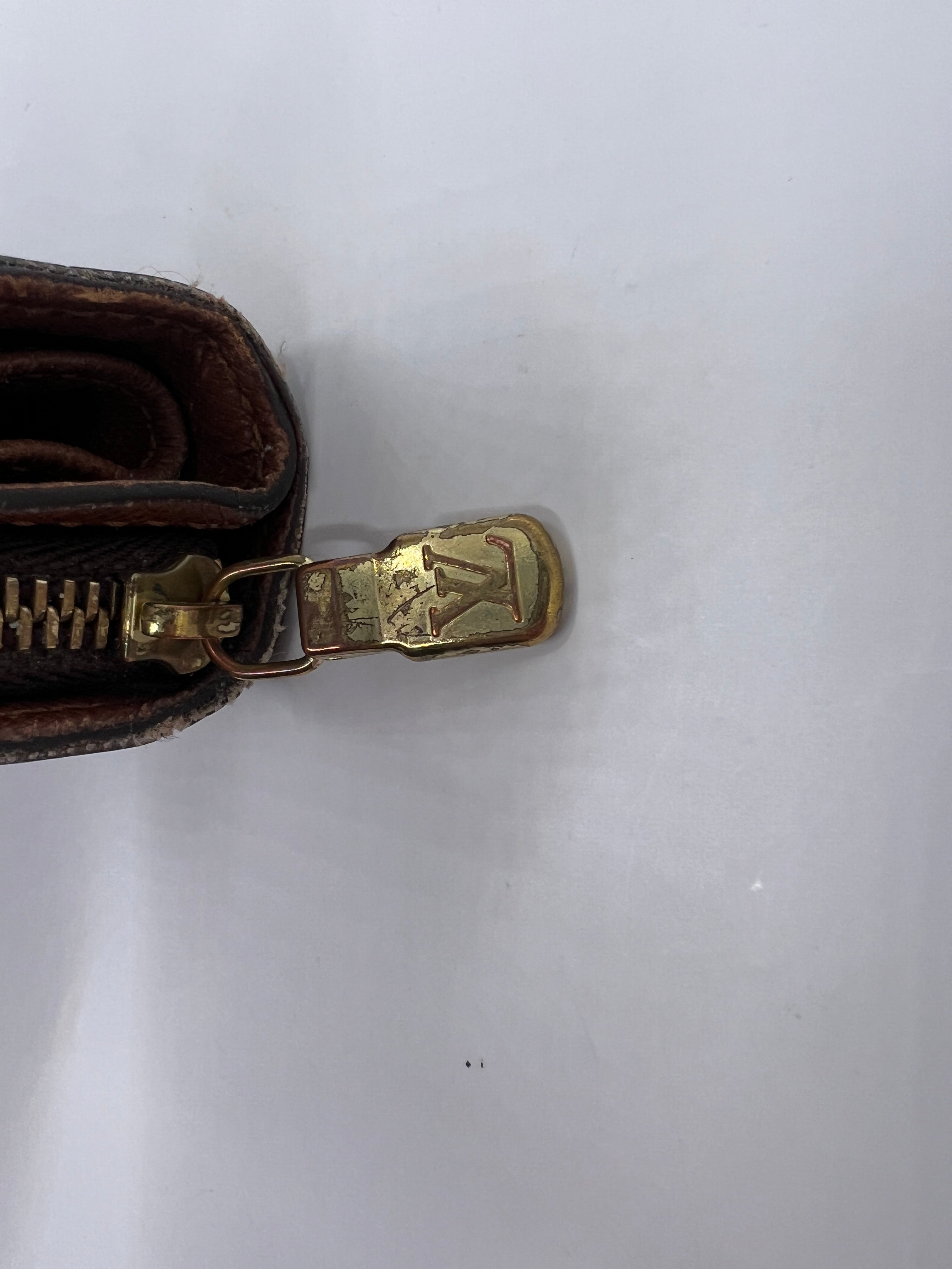 Louis Vuitton monogram compact wallet with snap closure