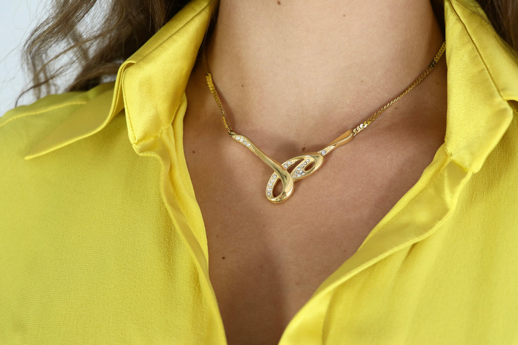 GIVENCHY Gold Rhinestone Infinity Necklace