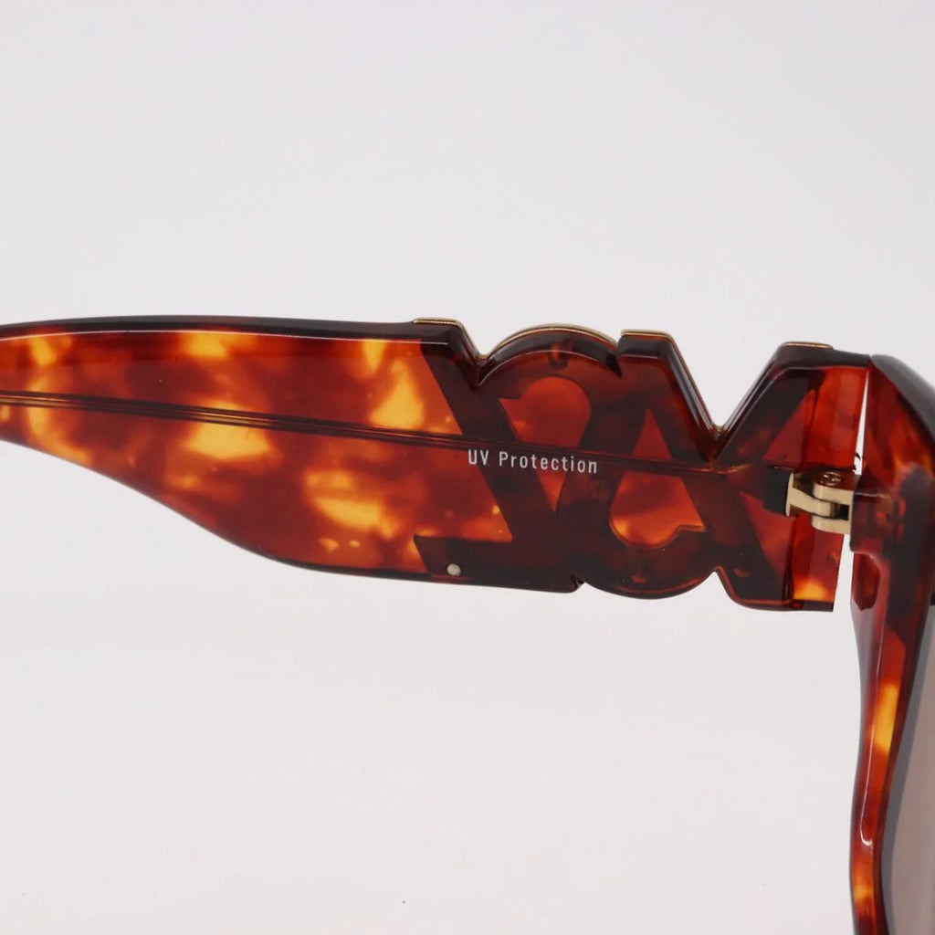 Yves Saint Laurent Vintage Tortoise Sunglasses — Sculptural Logo Hinge