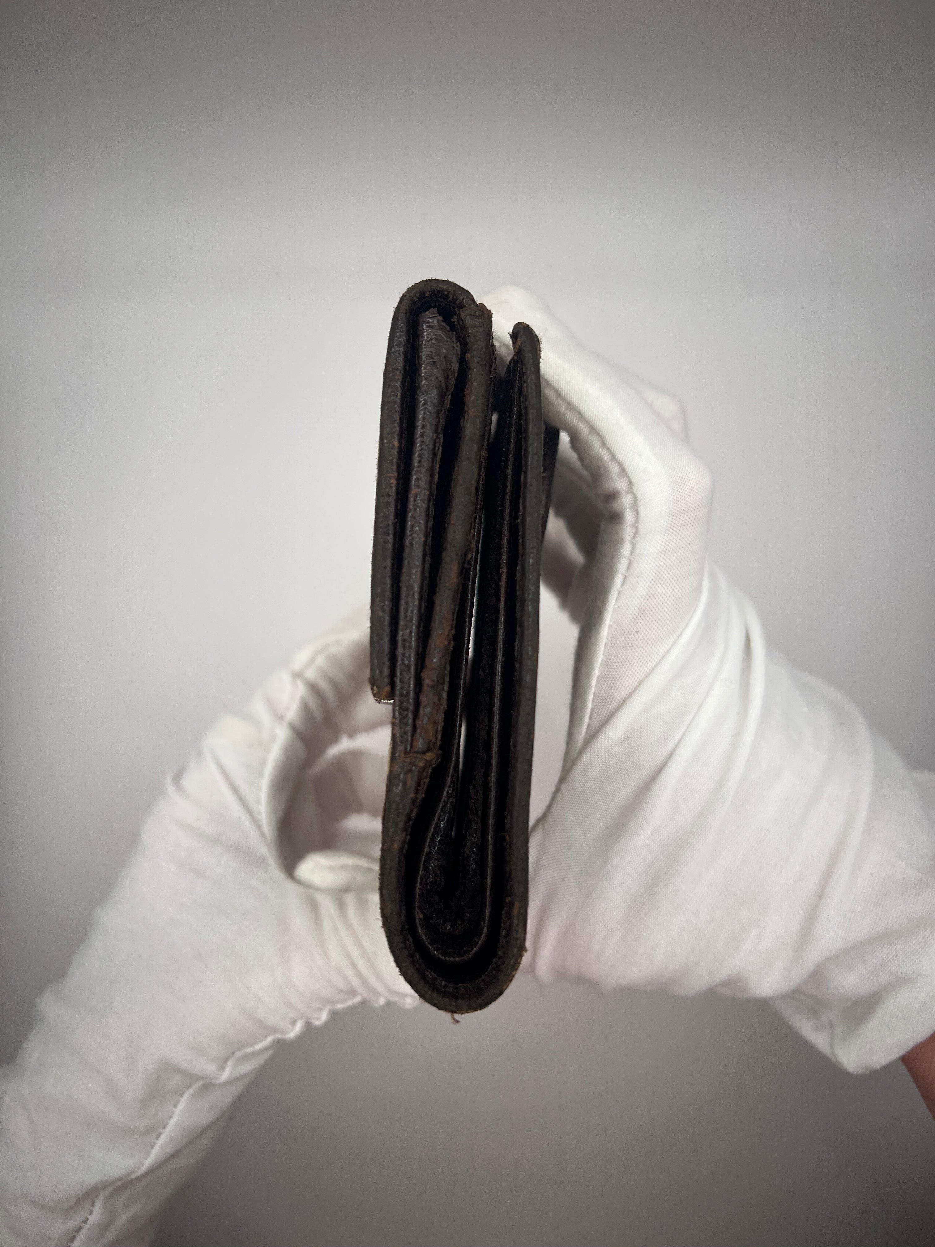 Gucci GG Supreme Canvas Bifold Wallet with Silver Logo Bar