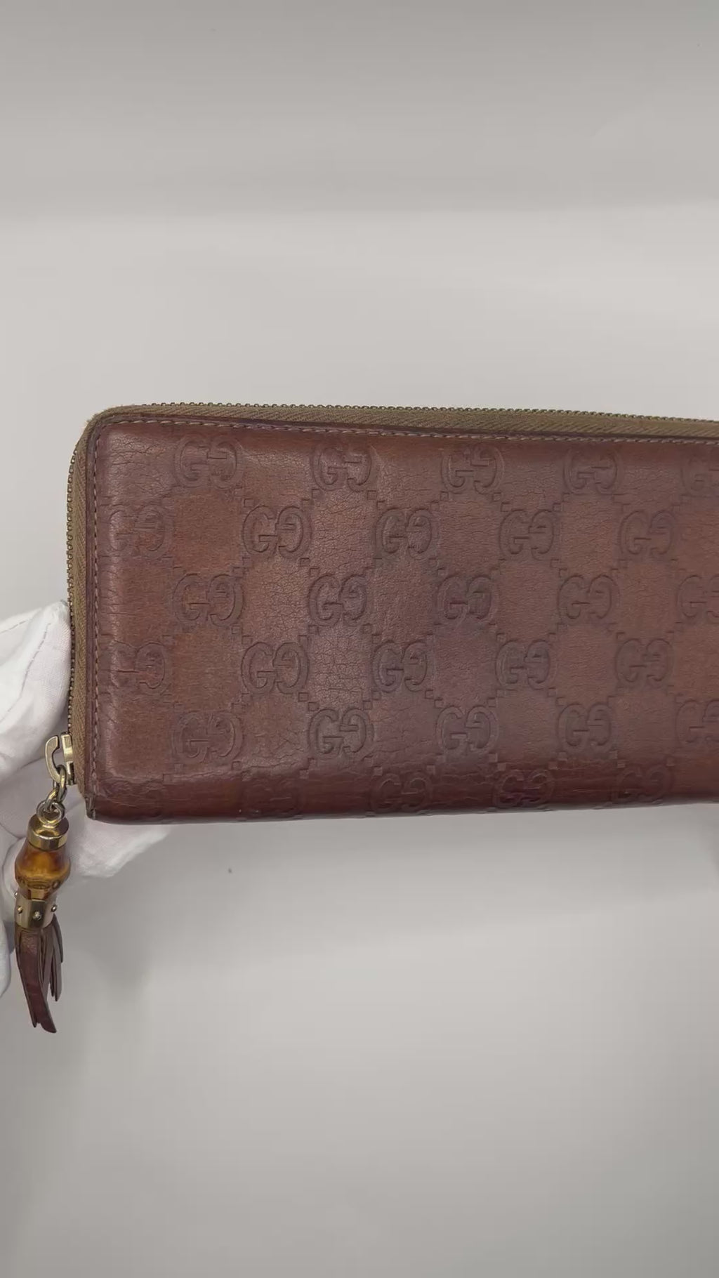 Gucci Guccissima Leather Zip-Around Wallet with bamboo tassel pull